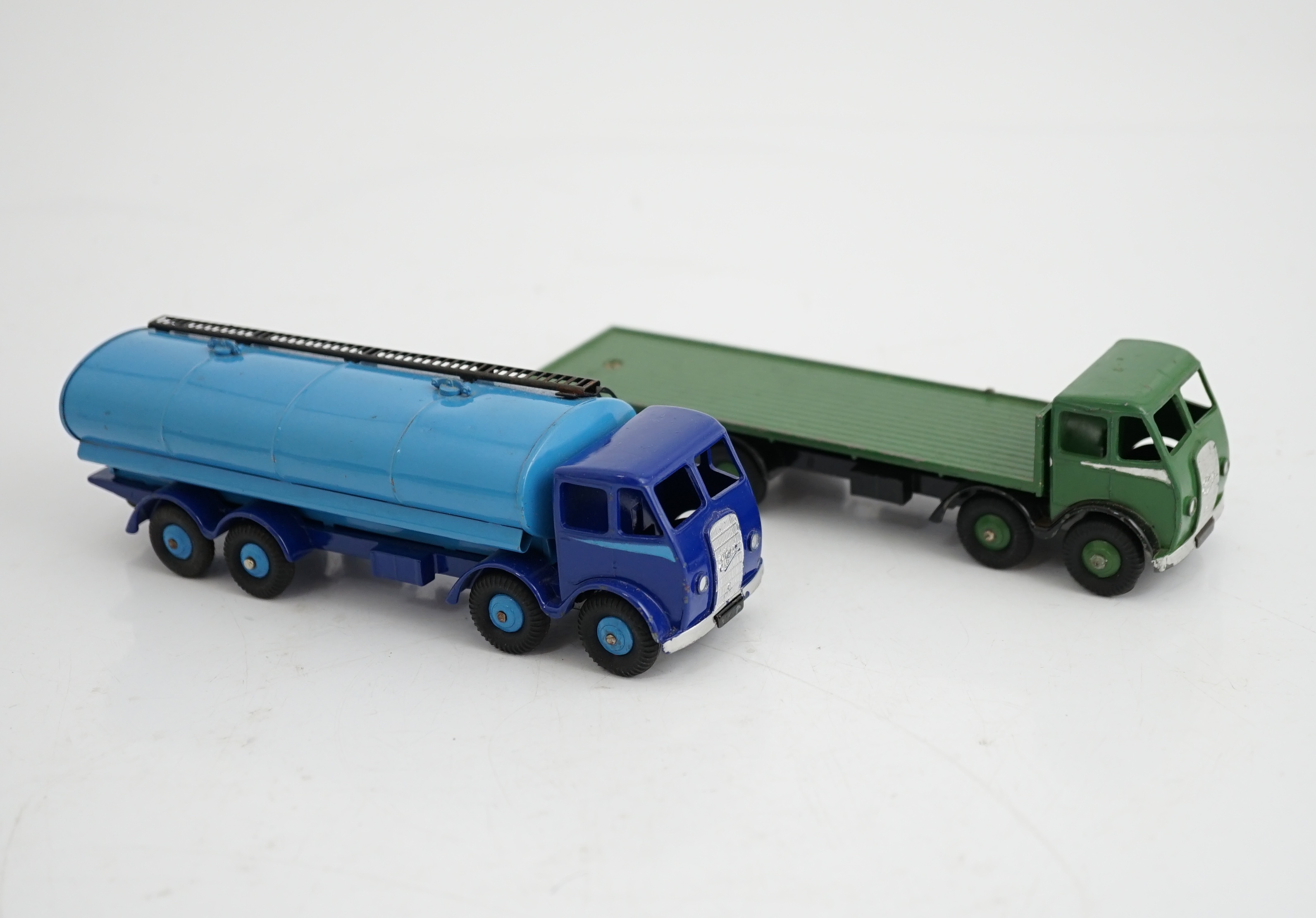 Two boxed Dinky Supertoys first type Fodens; a 14-ton tanker (504), with dark blue cab and chassis, and pale blue tank and wheels and a Flat Truck (502), in green with silver flash, in correct colour-marked box